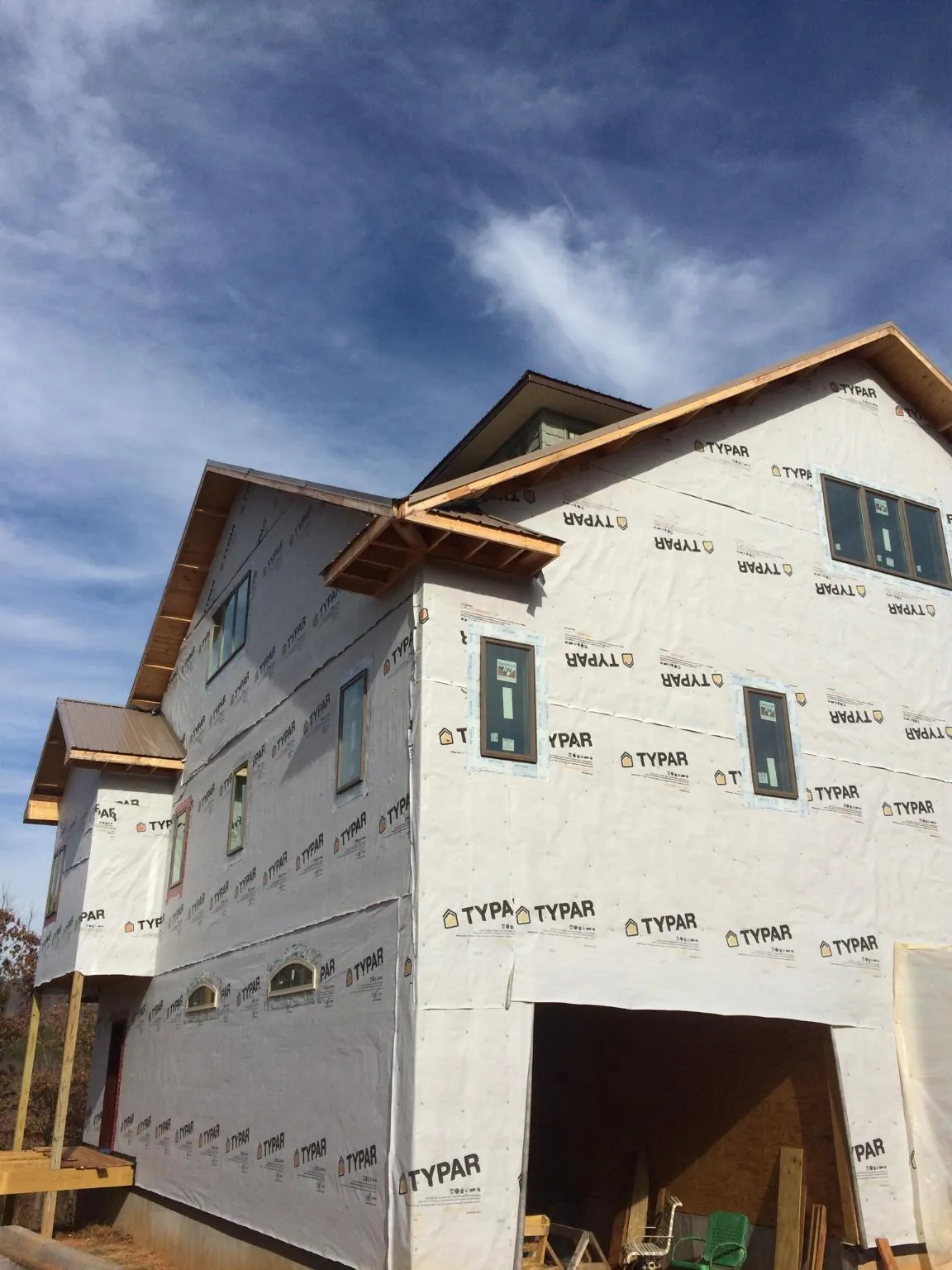 Stick built house wrapped in Typar with new roof framing and dormers in Newport